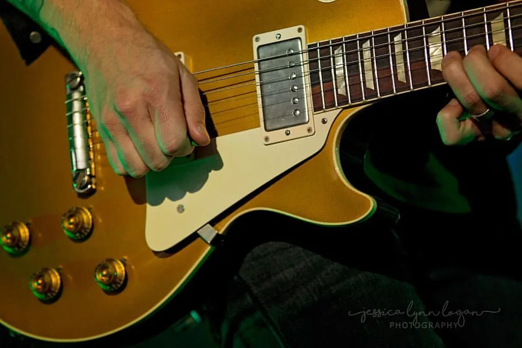 Guitarist playing an electric guitar Guitarist playing an electric guitar