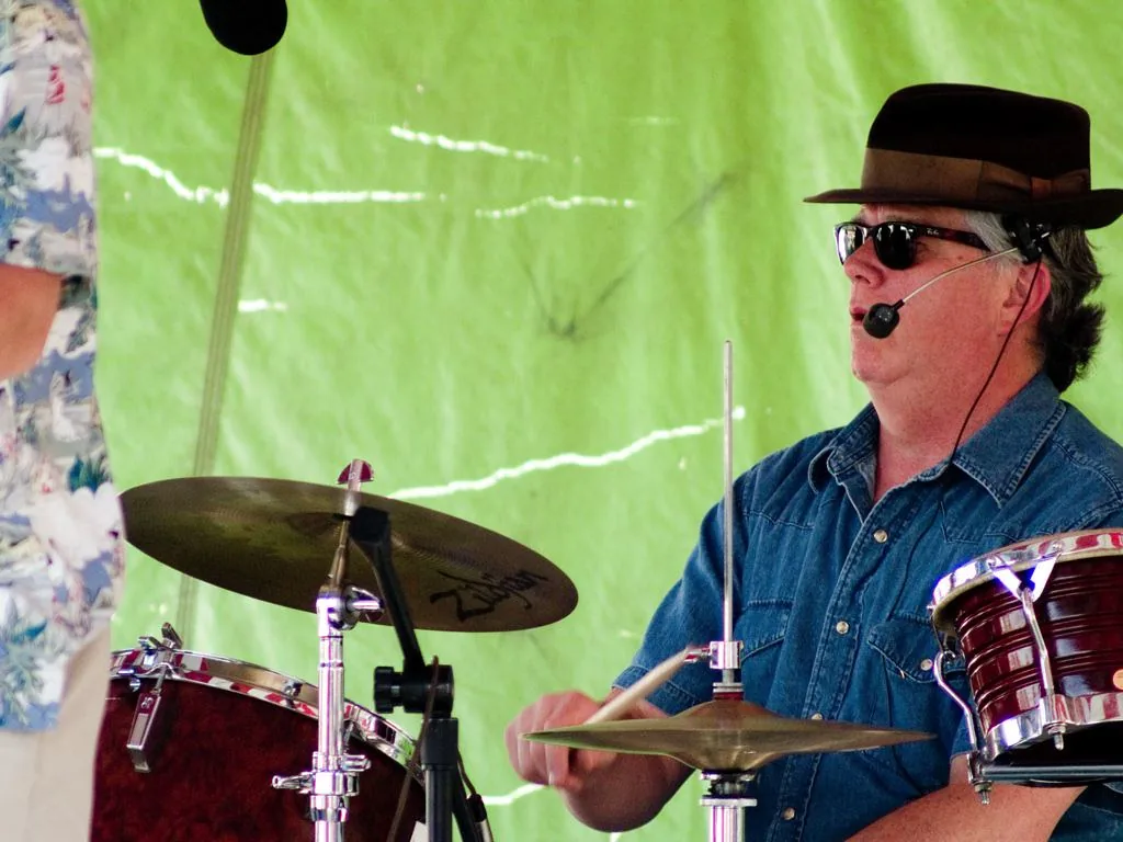 Drummer playing on an outdoor stage Drummer playing on an outdoor stage
