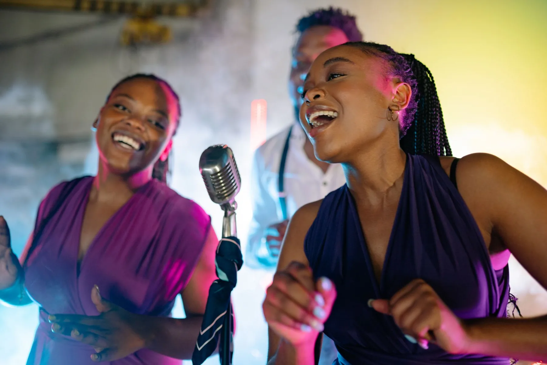 Pop singers in front of a microphone Pop singers in front of a microphone
