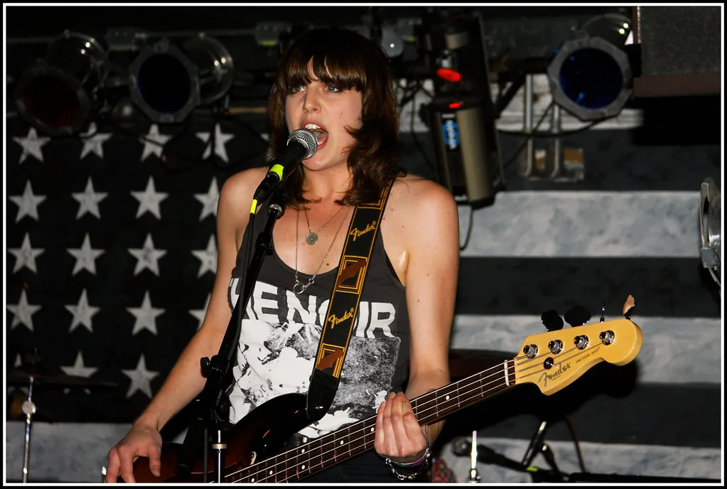 Female bassist and singer in a rock band Female bassist and singer in a rock band