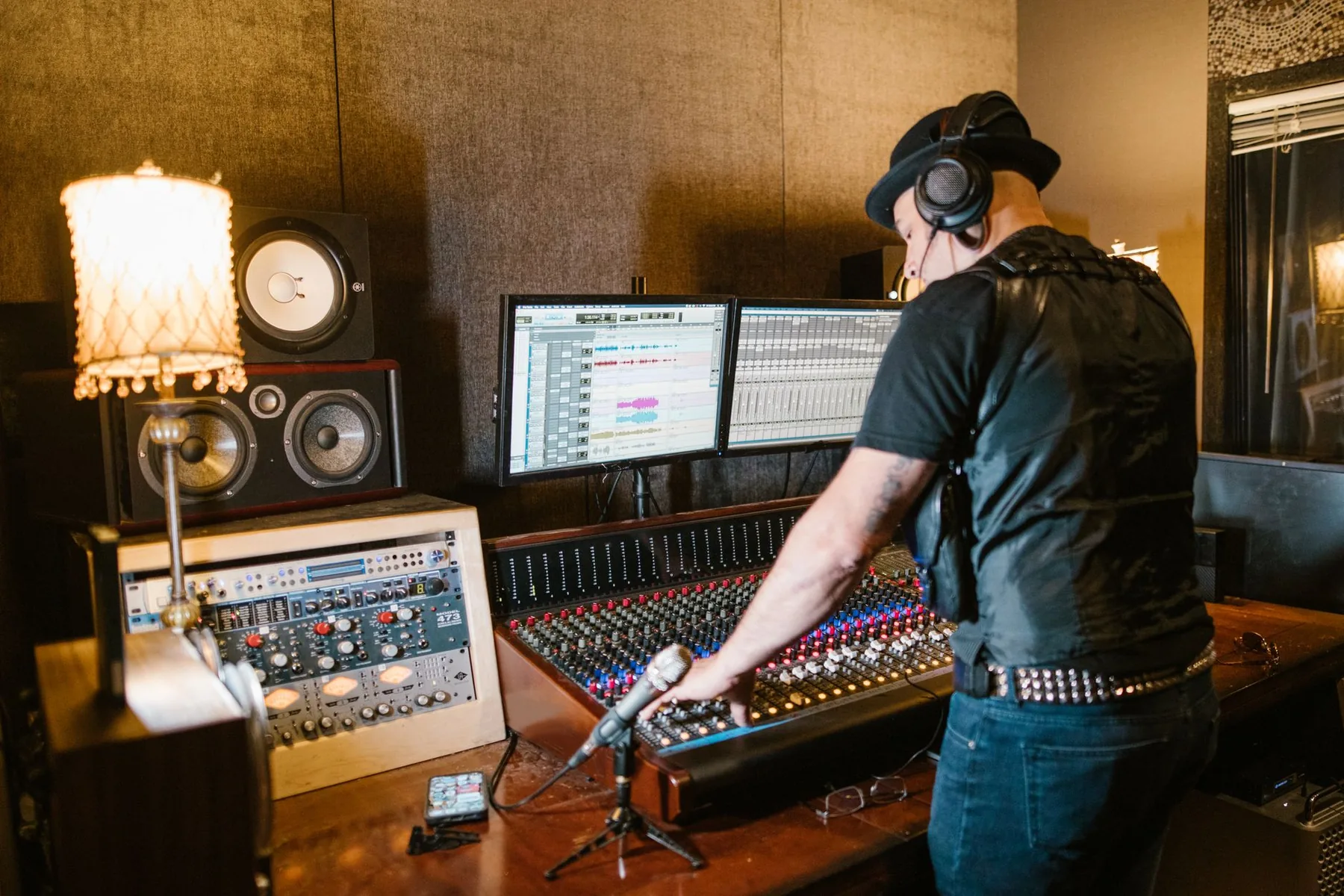 Producer working on a studio console Producer working on a studio console