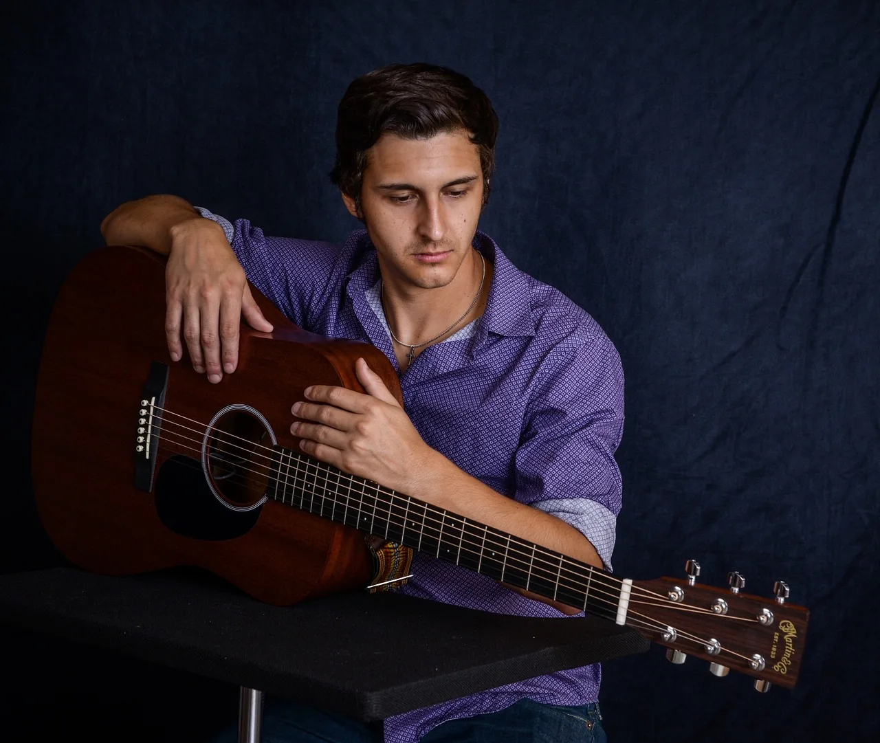 Acoustic guitarist with cross-genre influences Acoustic guitarist with cross-genre influences