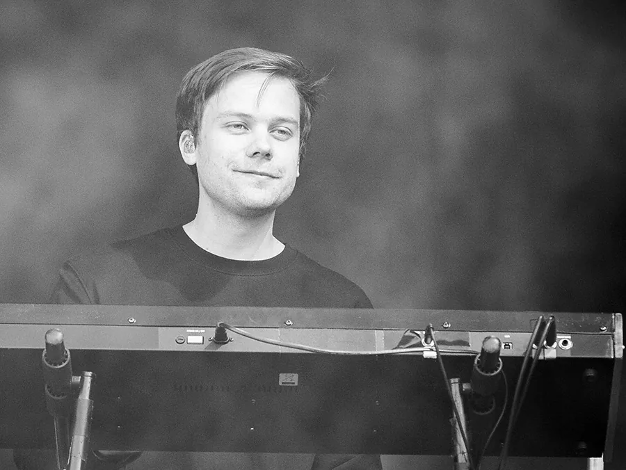 Pop-rock musician playing a synthesizer Pop-rock musician playing a synthesizer