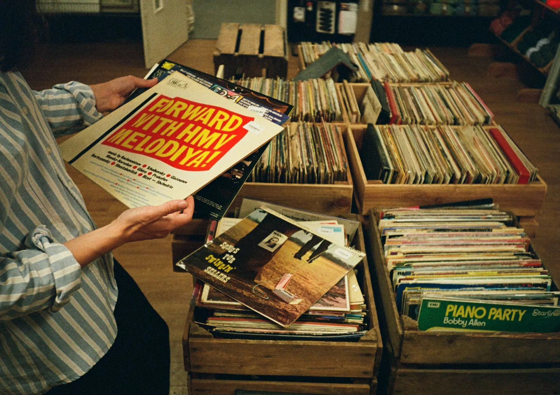 Collector choosing a vinyl record Collector choosing a vinyl record
