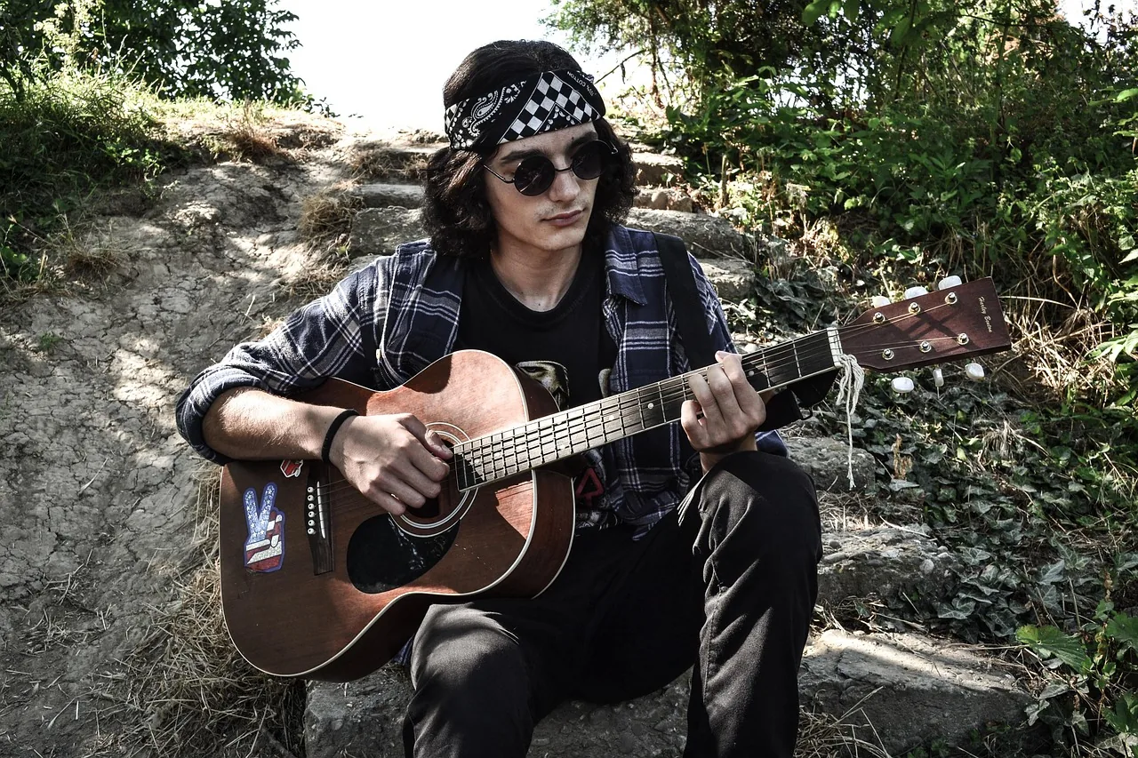 Independent musician playing guitar Independent musician playing guitar
