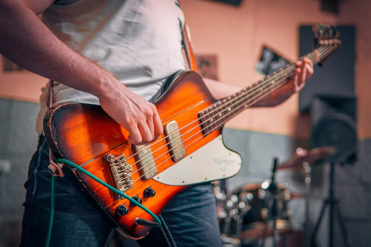 Bassist rehearsing in a music studio Bassist rehearsing in a music studio