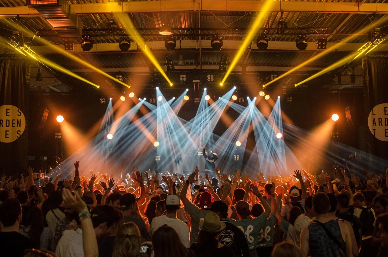 Enthusiastic crowd at a rock concert Enthusiastic crowd at a rock concert