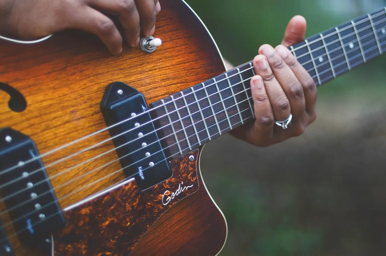 Musician playing an electric guitar Musician playing an electric guitar