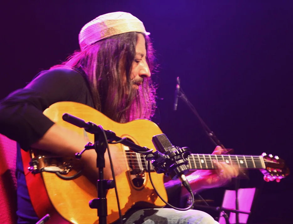 Guitarist performing onstage in concert Guitarist performing onstage in concert